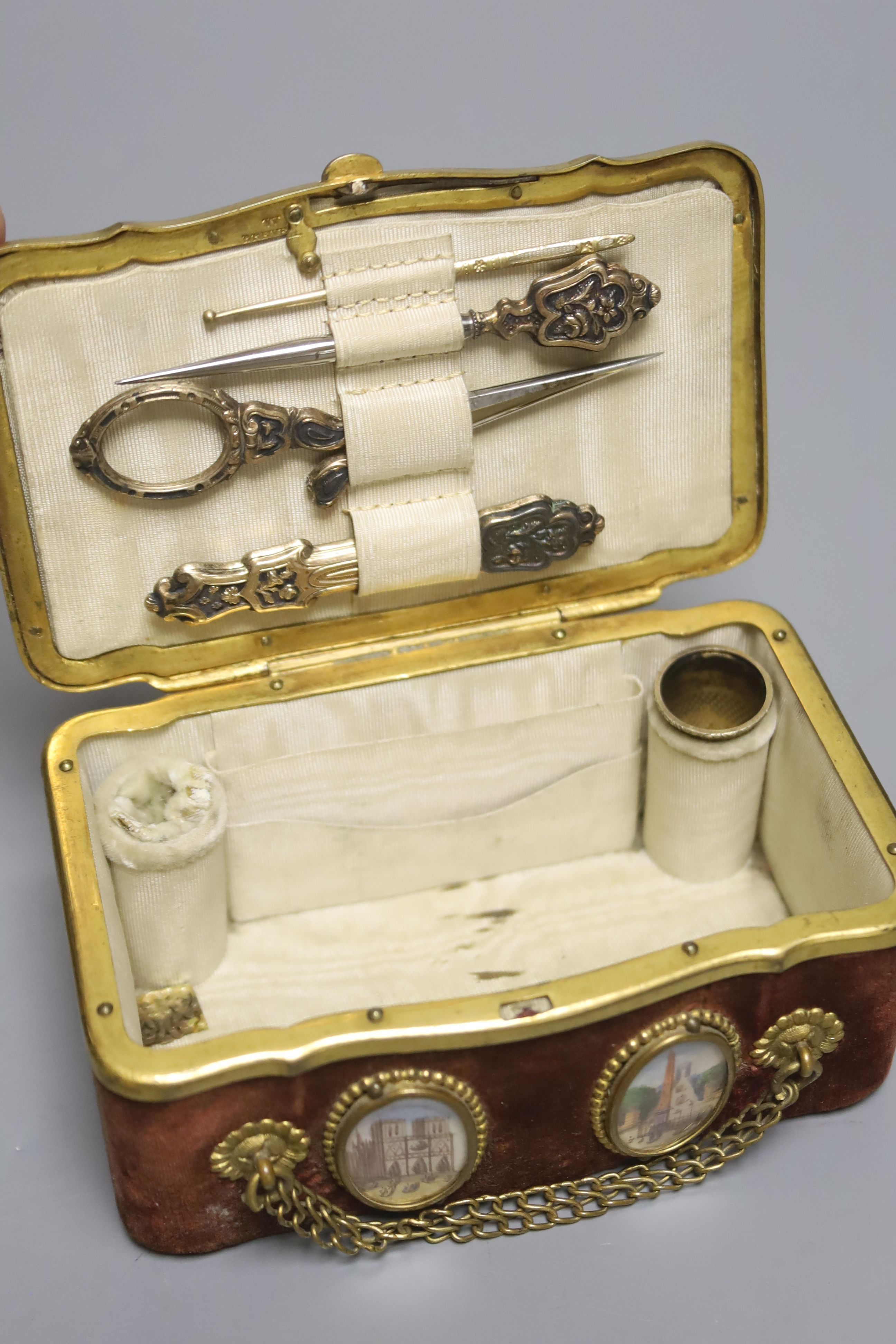 A 19th century French miniature velvet and gilt metal Palais Royale sewing casket, length 11.5cm